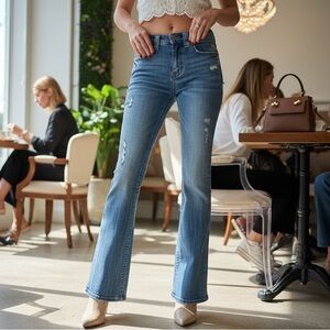 2B Bebe Light Blue Flare Jeans with Distressed Detail.